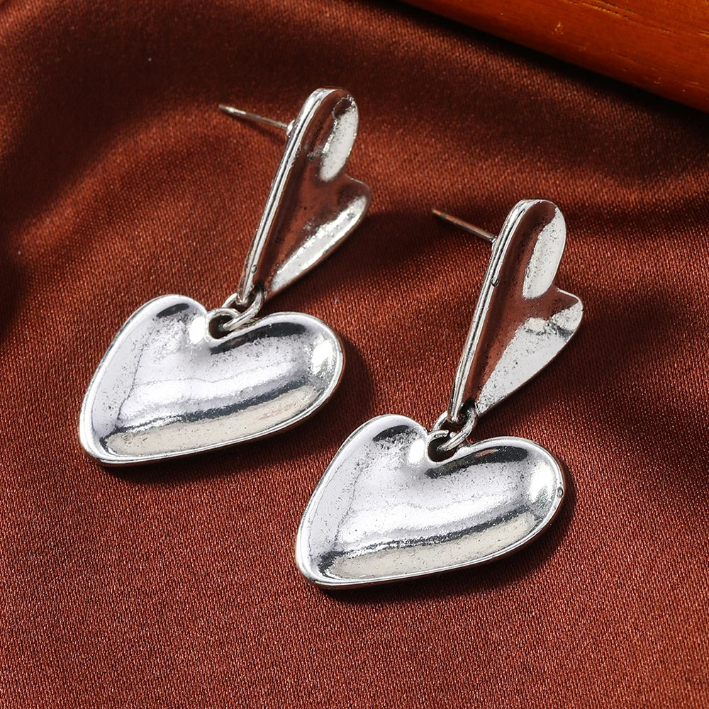 A pair of fashionable hanging earrings for women, creative, fashionable, simple, heart-shaped splicing earrings, affordable text